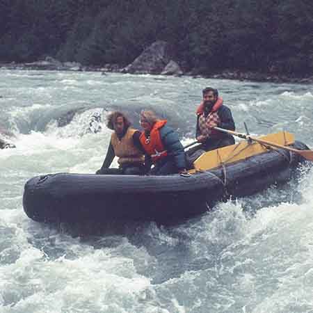 Yes, I am wearing a very strange life jacket. The best available at the time were being made for speedboat races in Puget Sound. Peter has a slim kayakers life jacket, and Georgeanna is wearing the commonly available "toilet seat" jacket. Marida has walked around the rapid in order to take the photo. With only one raft, photography of the raft was not easy.