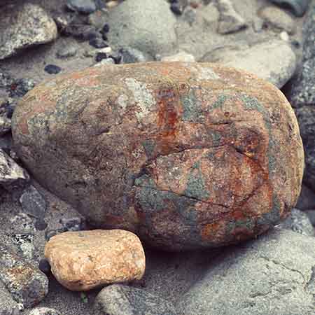 Taken at Henshi Creek Campsite. Rocks move downstream, this one from a different source than the others around it.